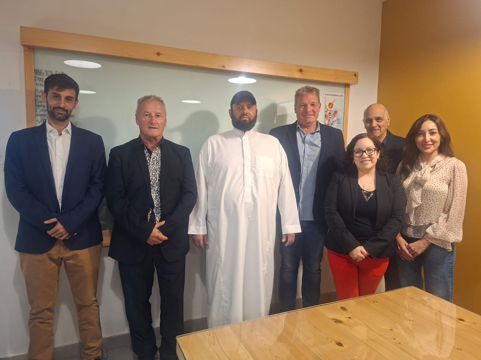 Maktub and partners team photo at business meeting